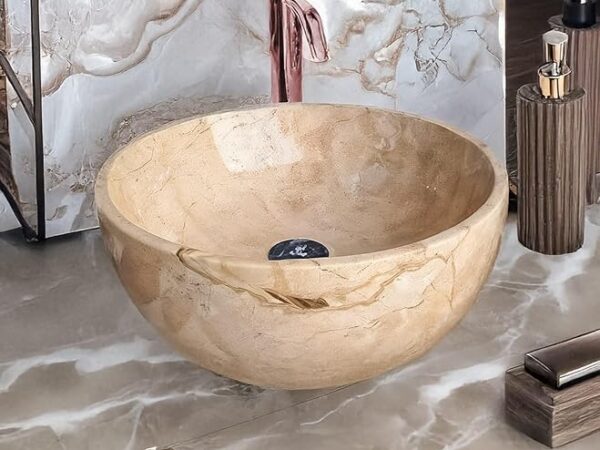 حوض حمام رخامي دائري بيج بتصميم بولة عصري مع حنفية بلون ذهبي وردي